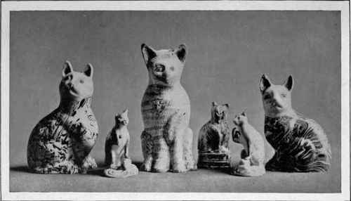 A Group Of Cats In Pottery