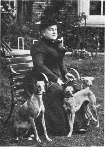 MRS. OUGHTON GILES WITH HER WHIPPETS.