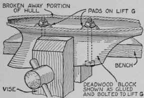 A partial view of the rough hull showing it held in the vise by the deadwood.