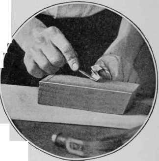 Fig. 5 (at right).   Filing the spur on the inside. To tile the outside would ruin the bit.