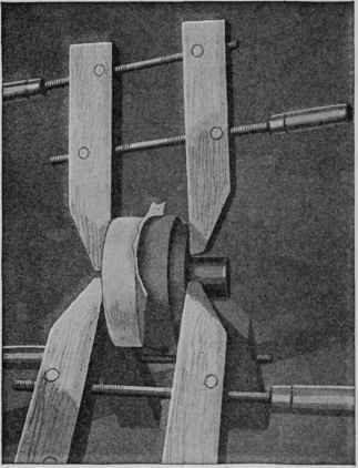 How the wood for a tray is glued to a piece of waste stock with a sheet of paper between, to facilitate splitting them apart.