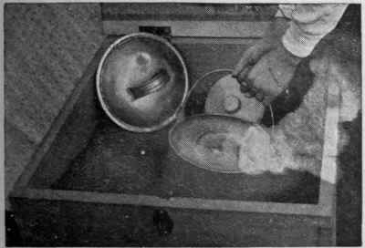 Dishing up a steaming hot dinner from the cooker. No attention need be given to the food from the moment it is placed in the cooker till it is taken out of it ware, aluminium, or any other material which may specially commend itself as suitable. 