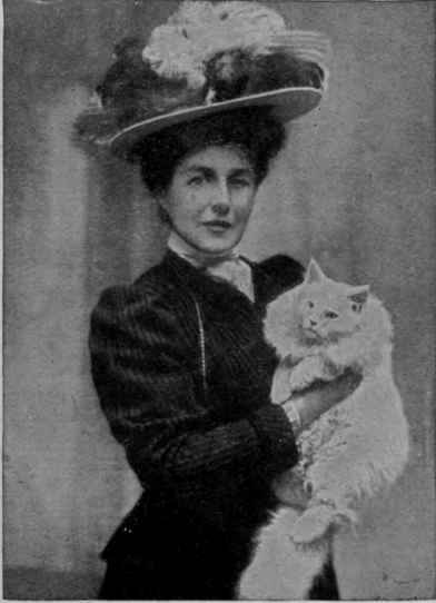 Miss Frances Simpson judging a white kitten at the Crystal
