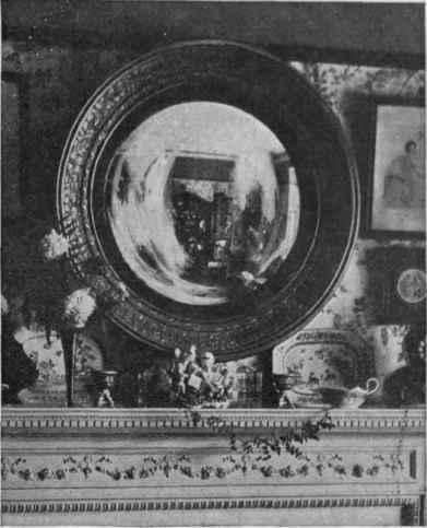 An excellent effect can be produced by a convex mirror judiciously hung so as to reflect a pretty interior