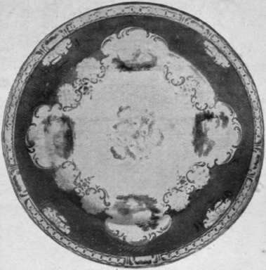 Dsssert plate of Rockingham porcelain, with green ground beautifully painted with small landscape panels and gilt lifting off its base to allow of the insertion of the light