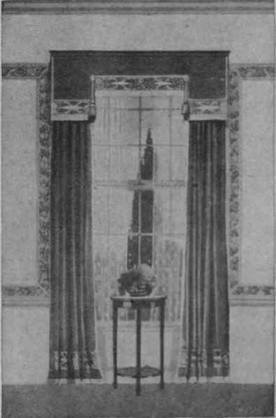 Fig. 3. A charming treatment in green linen with a printed border, that would look well in any modern room. The shape of the pelmet and unbroken lines of the curtains produce a most artistic effect