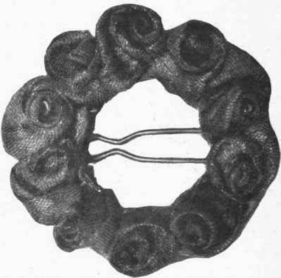 Fig. 5. A charming hair slide, decorated with little roses of gold or silver tissue. Ribbon roses can be used if preferred