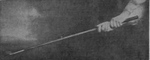 Figure 1. Position of the wrist and club at the finish of a niblick shot out of a bunker