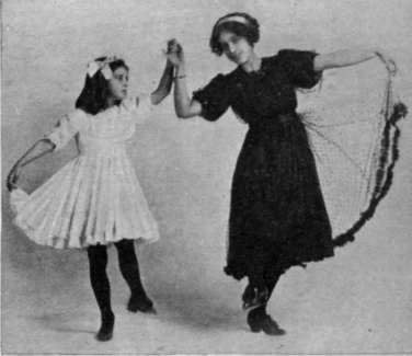 Figure 4. Fourth step. The pupil lifts her left foot forward, and the teacher her right. A slight spring should be given when these steps are taken by children
