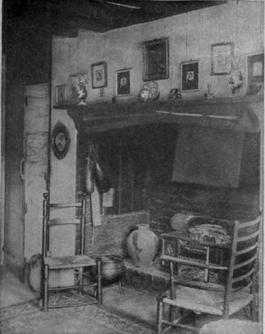 How an old fashioned cottage fireplace can be adapted to modern requirements without spoiling its interesting character candelabra of bent ironwork, either for a lamp or candles, looks well on the table.