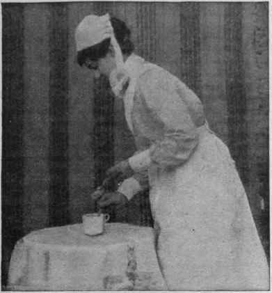 Making a castor oil emulsion that is practically tasteless. The hot milk is in the cup; the nurse stirs in the castor oil, dropping it very gradually from the spoon