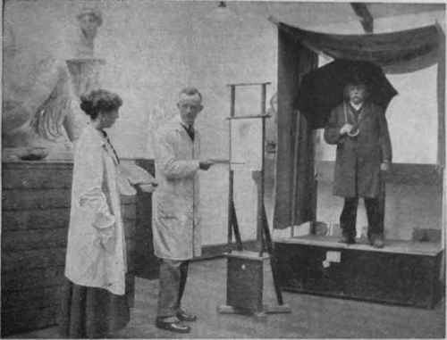 Mr. Byam Shaw criticising a student's work in the costume class, held daily in the afternoon