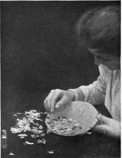 The putty should be allowed to show between the pieces of china, and when it has set firmly should be gilded