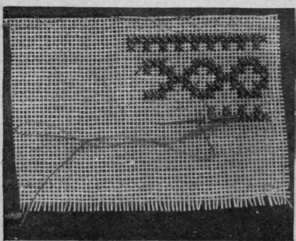 To work the cross stitch tack the canvas firmly to the material and work the design through both