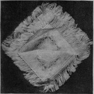 Toilet bag made out of two d'oyleys embroidered in cross and Holbein stitch occurs on the plain line and not in the more complicated corner.