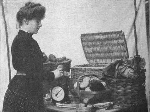 Weighing up and packing a half crown basket. The produce is first collected in bulk in the packing room and then sorted out for the separate hampers