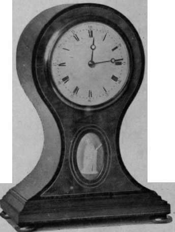 A simple design in inlaid satinwood, with a Wedgwood plaque