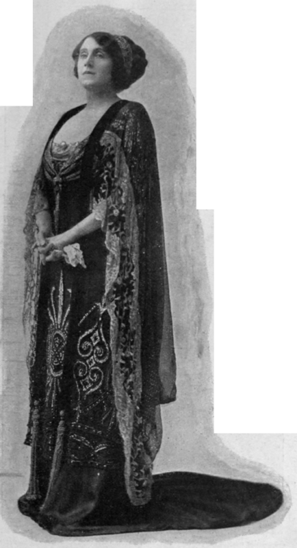 A gorgeous dress of black satin and tulle with silver and jet embroidery, well suited to the stately figure of the wearer, Miss Julia Neilson, in  The Popinjay 