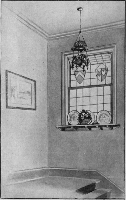 A suggestion for the artistic treatment of a staircase window. The plain glass ensures adequate light during the day, as does the Moorish lamp by night. A few plates firmly secured to the shelf lend a touch of colour and brightness