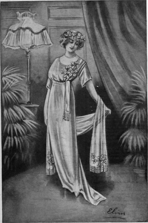 A white silk gown adorned with  hoar frost  embroidery would be a charming style for a debutante. The gauze shoulder scarf finished with a crystal bead fringe carries out the frost effect
