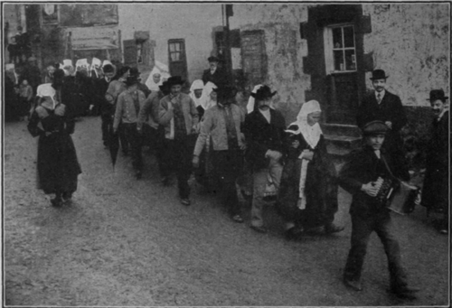 At Plougastel one day in every year is set apart for marrying all the engaged couples in the village. On Marrying Day this year (19125 twenty six couples were united. Above is depicted a typical procession to the church Photos, Central News