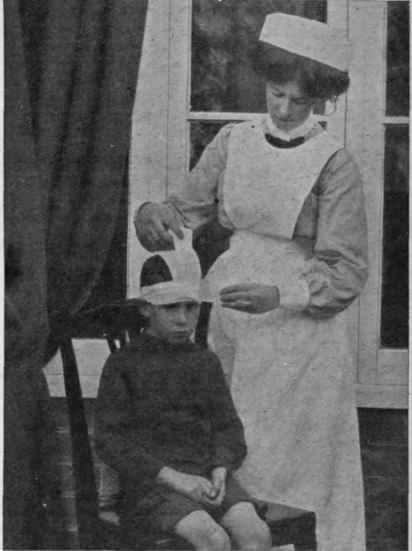 Bandaging the head. 3rd position. The vertical bandage, after being secured by the horizontal one, is carried across the top of the head to the left of the middle line