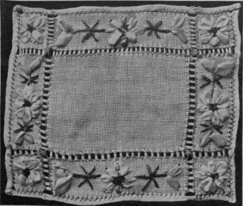 Hemstitched mat worked with ribbon in the delicate hydrangea shades is artistic, and by no means difficult to arrange if short lengths of narrow ribbon are available