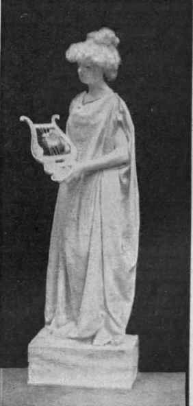 Melody, holding a lyre in her hand