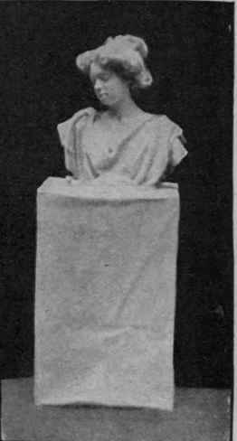 Mutilated bust. Black stockings are drawn over the arms to the required height