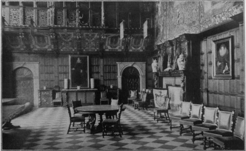 The great hall, Hatfield House. This noble room is oak panelled and hung with fine old tapestry. At one end is a massive cak screen, bearing the coats of arms of those connected with the house of Cecil