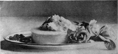 Ice Cream Molded In A Ring Mold, The Center Filled With Whipped Cream Colored Pink.