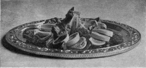 Salad Of Sliced Hard Boiled Eggs Arranged On Lettuce Leaves.