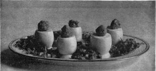 Salad Of Stuffed Eggs Garnished With Lettuce Cut Into Ribbons.