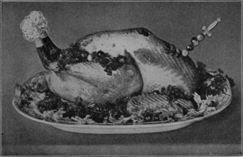 Roast Turkey, Garnished with Cranberries for the Thanksgiving Table. Recipe on Page 177.