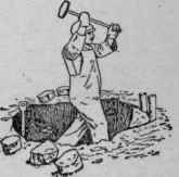 Digging the hole in frozen ground to receive the tree.