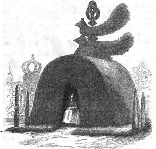 AN OLD CLIPPED YEW TREN.