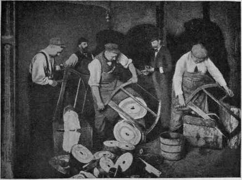 Fig. 235. Sampling Para rubber; in the centre balls of Para rubber cut transversely, showing the central hole.