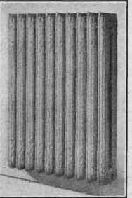 Fig. 27.   Two column radiator suspended from the wall by brackets.