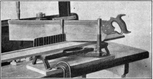 Fig. 106.   Iron Miter Box with Piece in Place Ready for Sawing.
