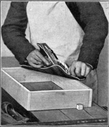 Fig. 160. Planing the Edge of a Box to Fit the Bottom.
