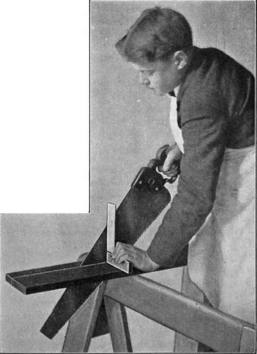 Fig. 19. Use of the Saw. Showing the method of using a try square to insure accuracy.