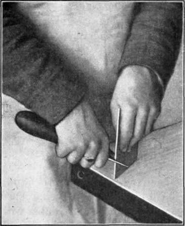 Fig. 54. Method of Grasping Scraper for Sharpening.