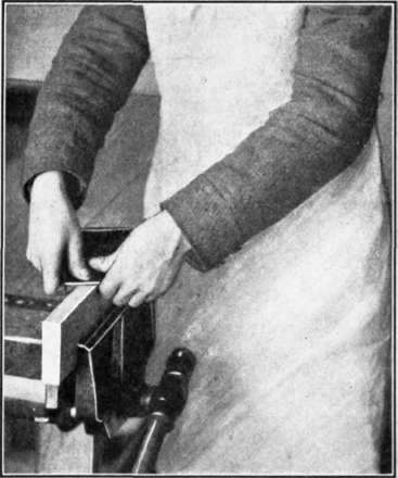 Fig. 60. Method of Grasping the Scraper when working upon an edge.