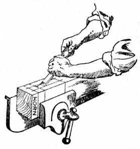 Fig. 184.   Removing Waste of Mortise with Chisel.