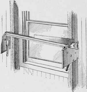 The saw vise attached to a window frame