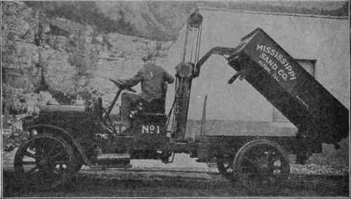 A 1 1/2 TON Truck of the Latest Model Dumping