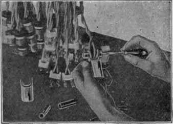 Fig. 6.   Operator Assembling Switch Plugs