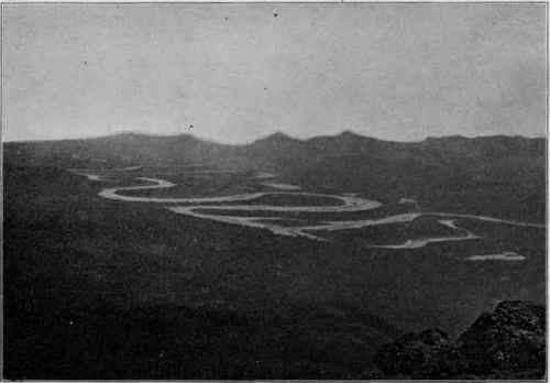 A meandering stream; ox bow lakes of the right: Alashuk River, Alaska. (U. S. G. S).