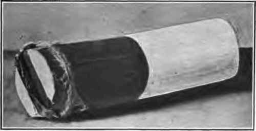 Wrapped briquette showing quick match and knot socket.